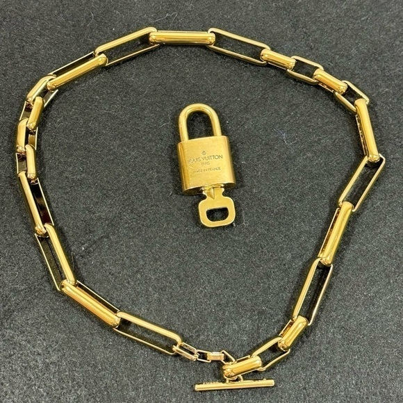 LOUIS VUITTON Brass Pad Lock as a pendant on a FOSSIL brass toggle necklace EUC - Picture 1 of 16
